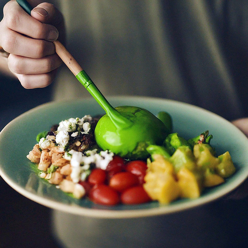 Food on a plate is painted green. Ai-generated picture.