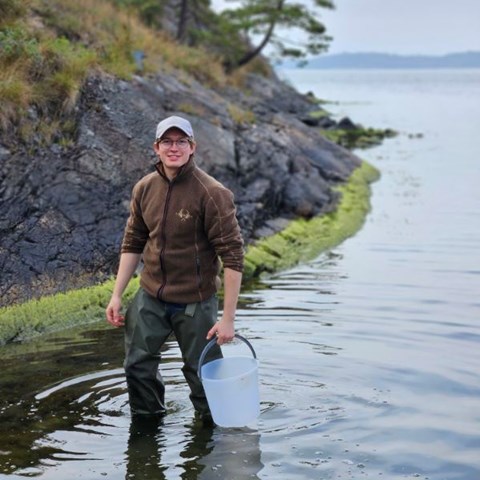 Oscar Juvall takes an algae sample