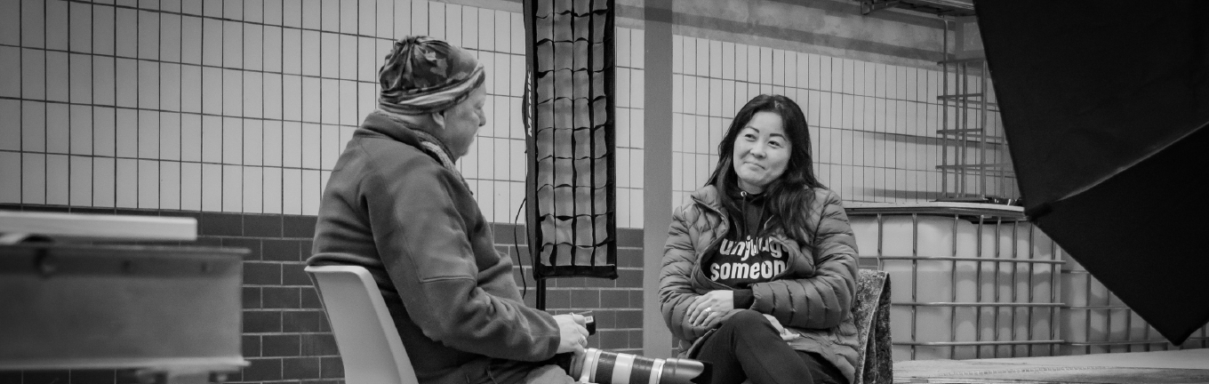 Two people in conversation with each other