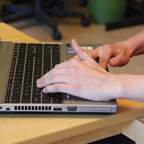 Hands type on keyboard. Photo.